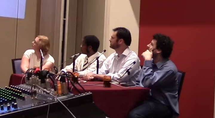 photo of The team of human players that competed against QANTA. Video screenshot courtesy of Jordan Boyd-Graber. From left to right: Kristin Sausville, Colby Burnett, Ben Ingram, Alex Jacob.